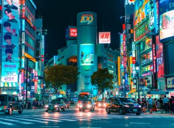 tokyo japan downtown nighttime cars traffic people walking busy